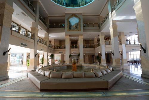 a large lobby with a large couch in the middle at Sunny Days El Palacio Resort & Spa in Hurghada