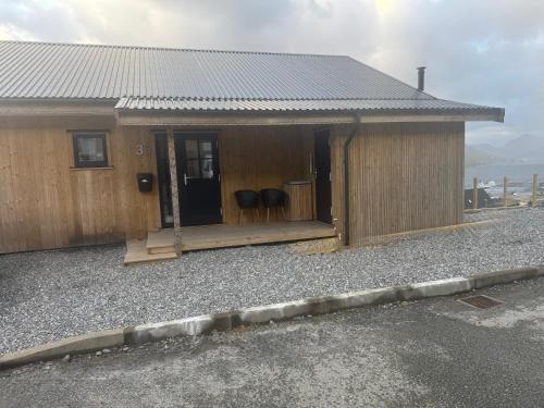 a small building with a porch and a door at Bright Home with Amazing View in Saltangará