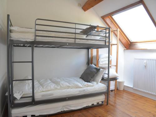a bedroom with bunk beds in a room with a window at Family Retreat, Forested Anhée in Denée