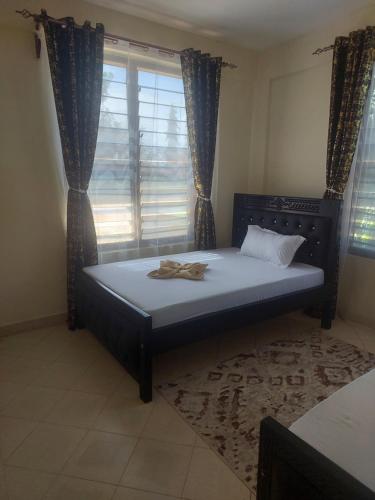 Postel nebo postele na pokoji v ubytování Nest Suites 2Bedroom Apartment