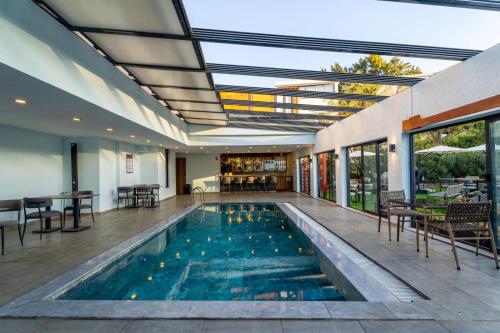an indoor swimming pool in a house at La Bonita Marina Hotel Bodrum in Bodrum City