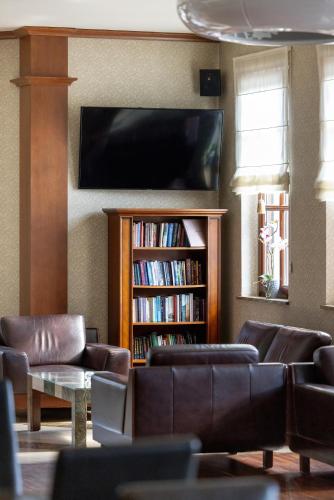 TV o dispositivi per l'intrattenimento presso Hotel&Spa Stary Dziwnów basen swimming pool