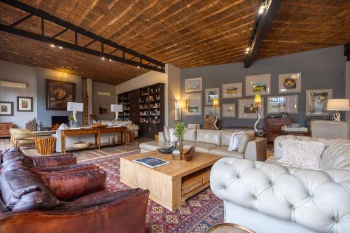 a large living room with couches and a table at Karongwe - Becks Safari Lodge in Hoedspruit