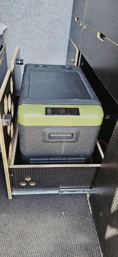 a suitcase sitting in a box in a drawer at Van Master in Puerto del Rosario