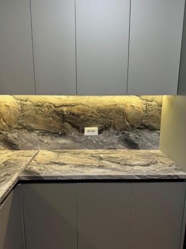 a marble counter top with a sign on it at The Lake Villa in Tirana