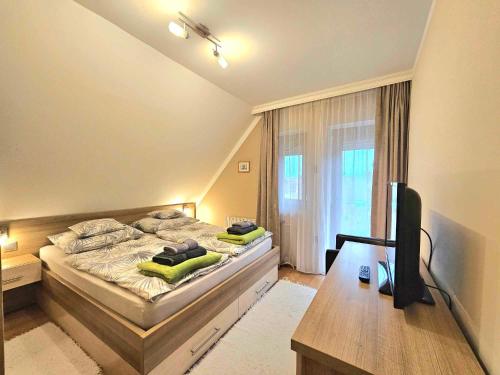 Un ou plusieurs lits dans un hébergement de l'établissement Apartman Siesta Bük - Bükfürdő