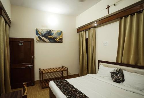 a hotel room with a bed and a window at The Harmony Circle - Jaipur in Jaipur
