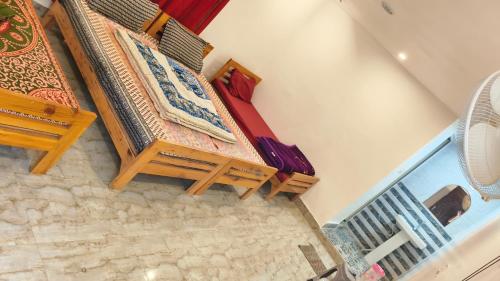 an overhead view of a room with a couch and chairs at Swagat hotel in Uttarkāshi