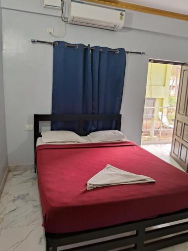 Ένα ή περισσότερα κρεβάτια σε δωμάτιο στο Calangute Pristine Guest House