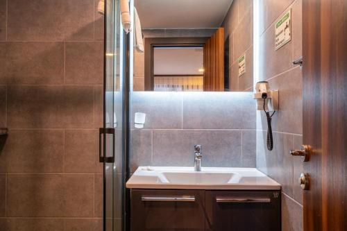a bathroom with a sink and a shower at La Bonita Marina Hotel Bodrum in Bodrum City