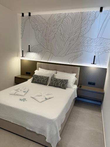 Una cama o camas en una habitación de Infinity Palm Villa
