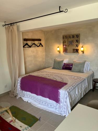 a bedroom with a large bed in a room at La Ladera Bay View in La Herradura