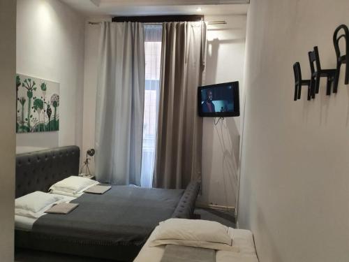 Кровать или кровати в номере HAPPY DAYS APARTHOTEL Krakow