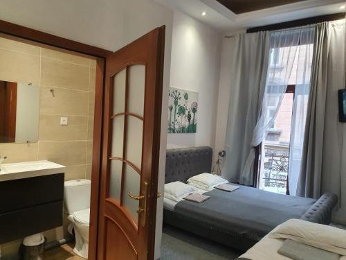 Кровать или кровати в номере HAPPY DAYS APARTHOTEL Krakow