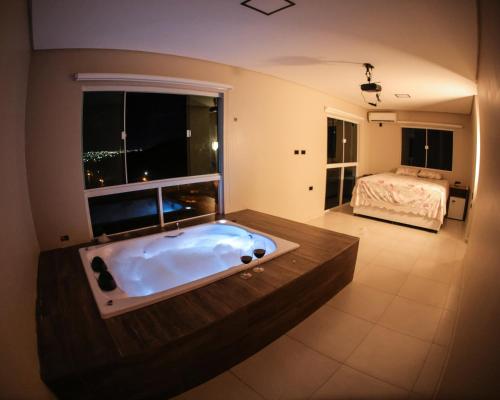 เตียงในห้องที่ Ecos da Serra