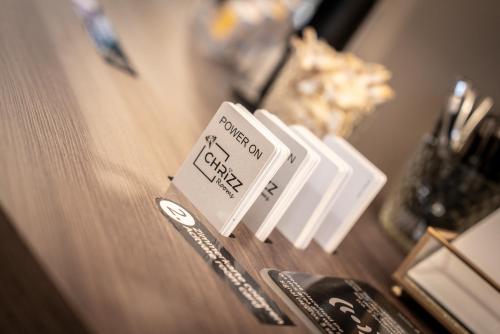 a wooden table with a sign that reads bourbon anxiety at CHRIZZ Rooms in Graz