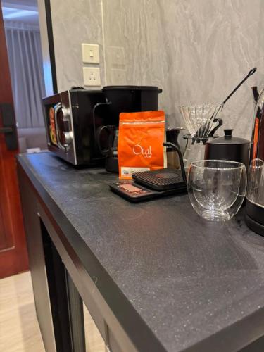 a counter top with a coffee maker on it at Luxurious studio with a modern design - Al Faisaliah neighborhood in Jeddah