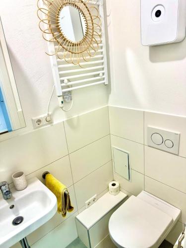 a small bathroom with a toilet and a sink at Apartment 2 in Stockach