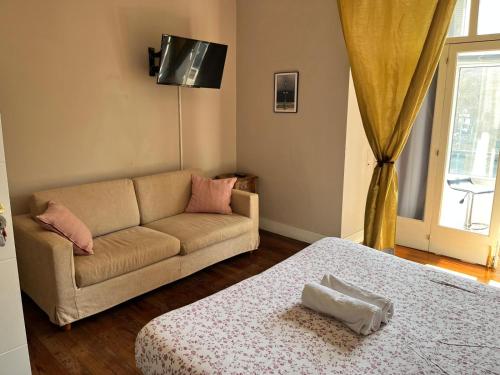 a living room with a couch and a table at Kasa Reina HT LSS00215 in Donostia-San Sebastián