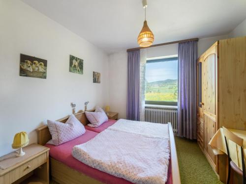 Ένα ή περισσότερα κρεβάτια σε δωμάτιο στο Ferienhaus in Bayern am Großer Arber