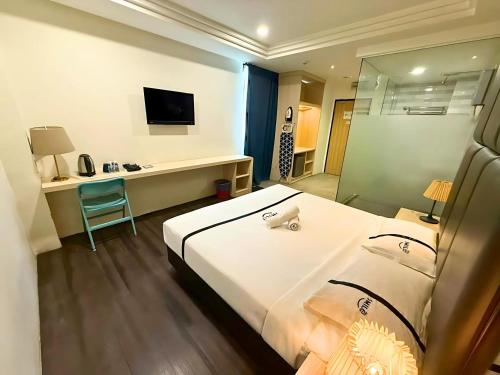 Ένα ή περισσότερα κρεβάτια σε δωμάτιο στο Seeds Hotel Ampang Point