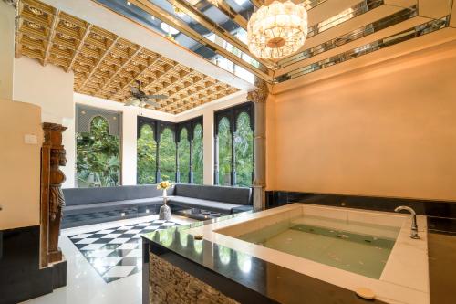 a large room with a large tub in the middle at The Royal Retreat Resort & Spa in Udaipur