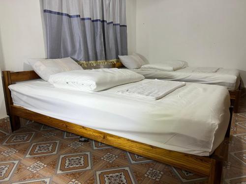 Katil atau katil-katil dalam bilik di KP Dorm Nongkhiaw
