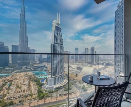 a view of a city from the balcony of a building at Burj Royale - Luxury Stay with Panoramic Burj Khalifa & Fountain View in Dubai