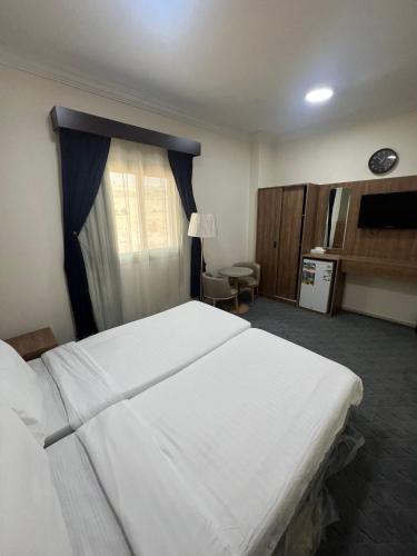 Postel nebo postele na pokoji v ubytování Jawaher Al Hashmiya 4 Hotel Makkah by Moro
