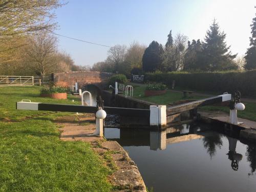 a bridge over a canal in a park at Dragonfly Two in North Newton