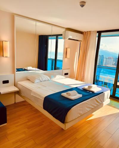 Ένα ή περισσότερα κρεβάτια σε δωμάτιο στο Luxury orbi panorama Aparthotel