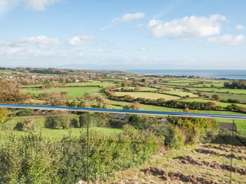 an aerial view of the countryside and the ocean at Maes Teg in Abererch
