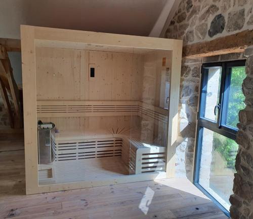 a room in a house under construction with a window at Le Clos d'Aboulin in Saint-Christophe-dʼAllier