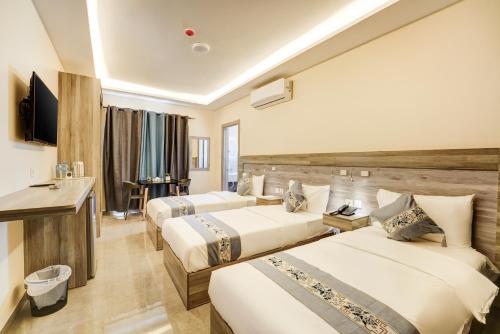 Ένα ή περισσότερα κρεβάτια σε δωμάτιο στο aqaba hills hotel