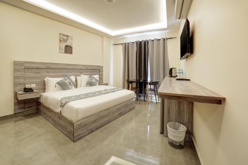 Ένα ή περισσότερα κρεβάτια σε δωμάτιο στο aqaba hills hotel