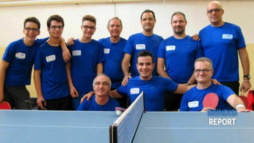 a group of men in blue shirts posing for a picture at DRIL Host 1 in Brindisi