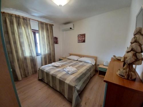a small bedroom with a bed in a room at Sardegna Casa Ruby Baia de bahas Marinella in Santa Marinella