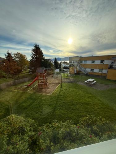 a view of a yard with a playground at Arctic Homestay with Northern light view room in Tromsø