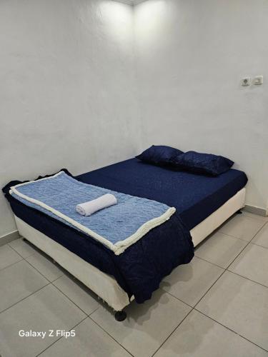 Кровать или кровати в номере Erigeron homestay dieng