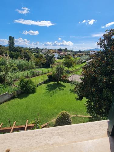 a view of a green field with trees and buildings at B&B Camera delle Camelie in Palestrina