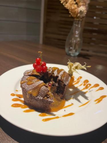 a piece of cake on a plate on a table at Domaine Saône-Valley in Traves