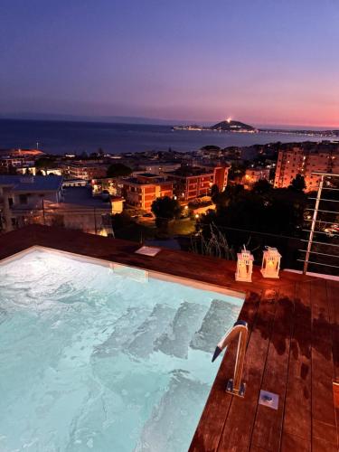 a pool on the roof of a building with a view at Formia Bellevue in Formia