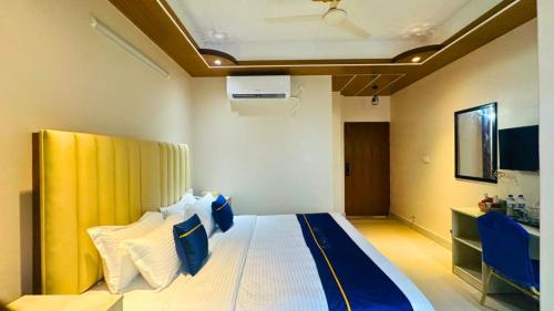 Кровать или кровати в номере The Ambassador Hotel Dhanmondi