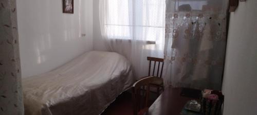 Ein Bett oder Betten in einem Zimmer der Unterkunft Shushan GUEST HOUSE
