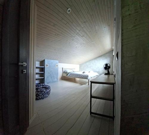 a room with a bed and a room with a table at Lucy in Yaremche
