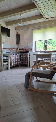 a living room with a table and a kitchen at Lucy in Yaremche