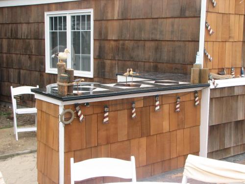 a bar on the side of a house at Lighthouse Lodge & Cottages in Pacific Grove