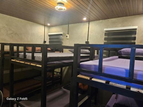 a group of bunk beds in a room at Casa Tolentino Tagaytay - Full house in Tagaytay