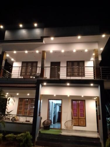 a view of a house at night at Eha Mundro Island Homestay in Munroe Island