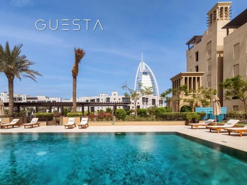a view of the burj khalifa from the swimming pool of a hotel at Lamtara 1 - Madinat Jumeirah Living, Jumeirah in Dubai